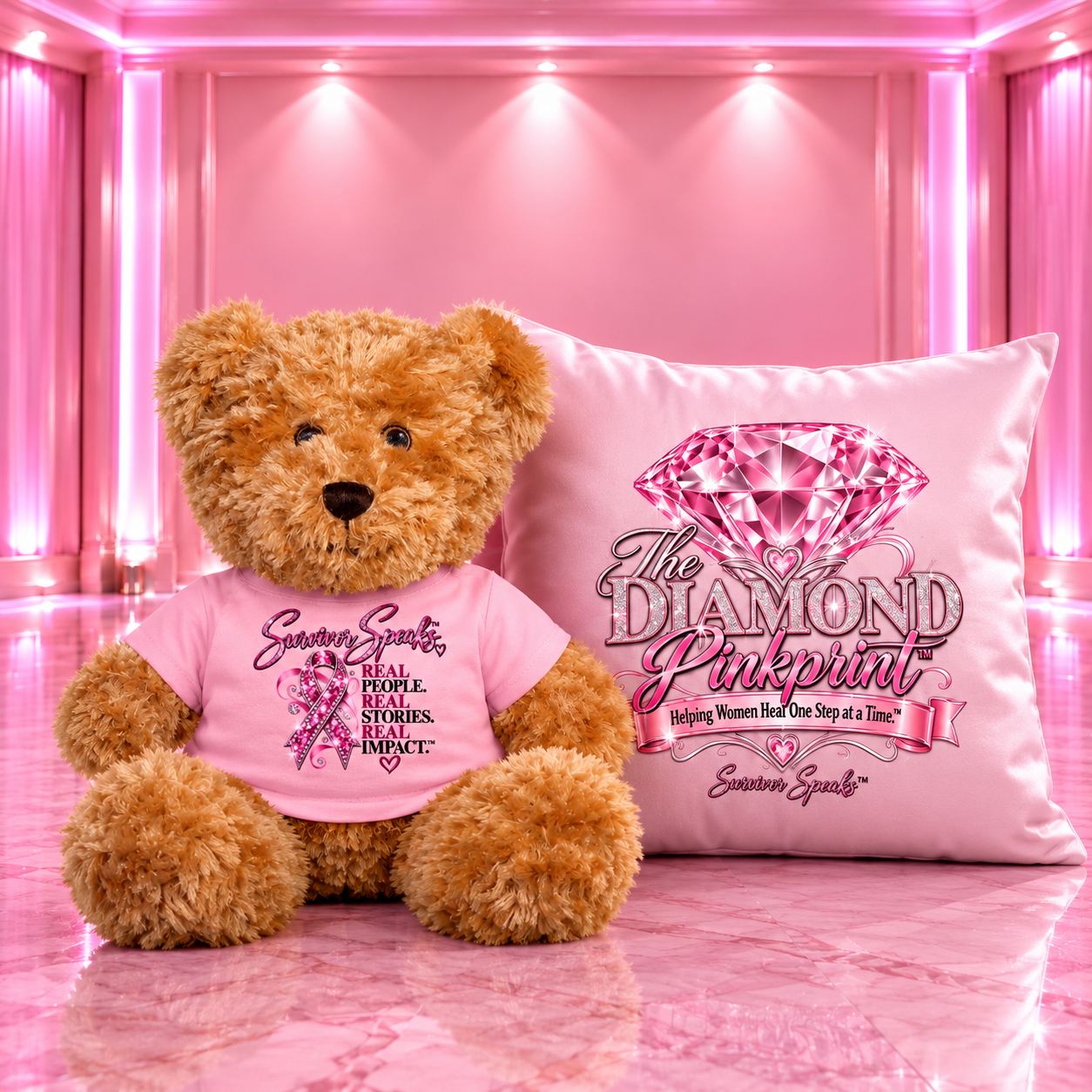Teddy bear in a pink Survivor Speaks™ shirt beside a pink The Diamond Pinkprint™ pillow